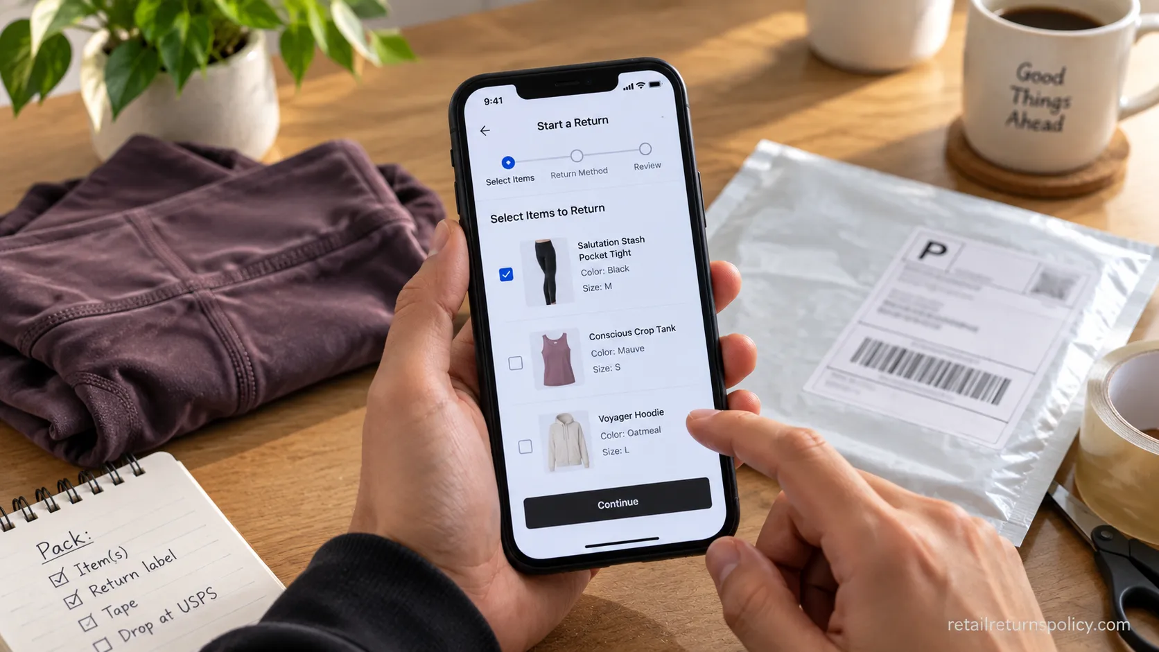 Hands holding a phone starting an Athleta mail return, video thumbnail.