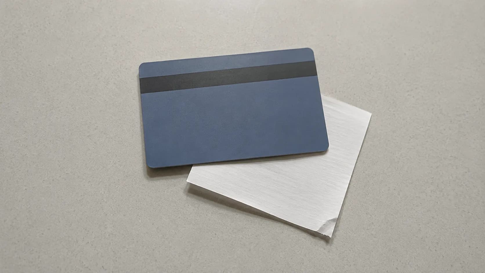 Editorial illustration showing a no-receipt return processed as a shopping card refund with a plastic gift card and paper slip on a counter