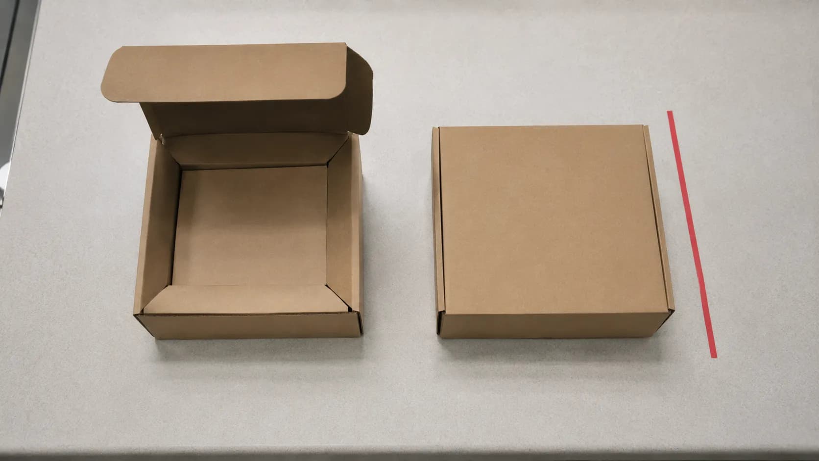 Overhead view of two product boxes showing an opened item and a sealed item side by side to illustrate different return policy outcomes