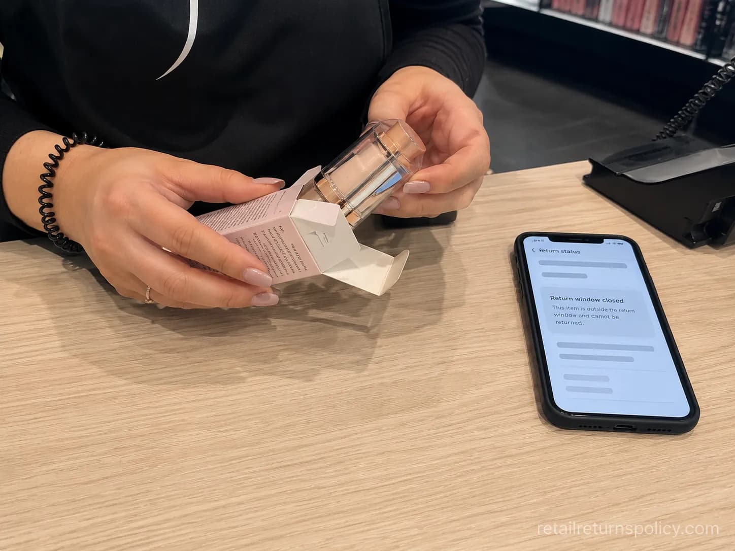 Sephora associate opening a sealed item to verify a return after 30 days