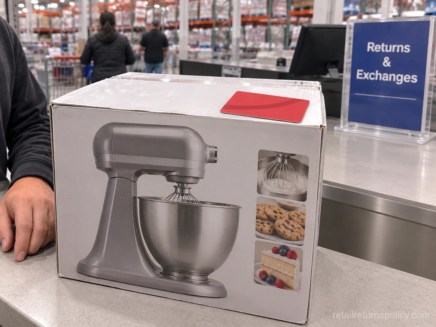 A boxed kitchen mixer on a Costco returns counter with the red Shop Card issued as a refund