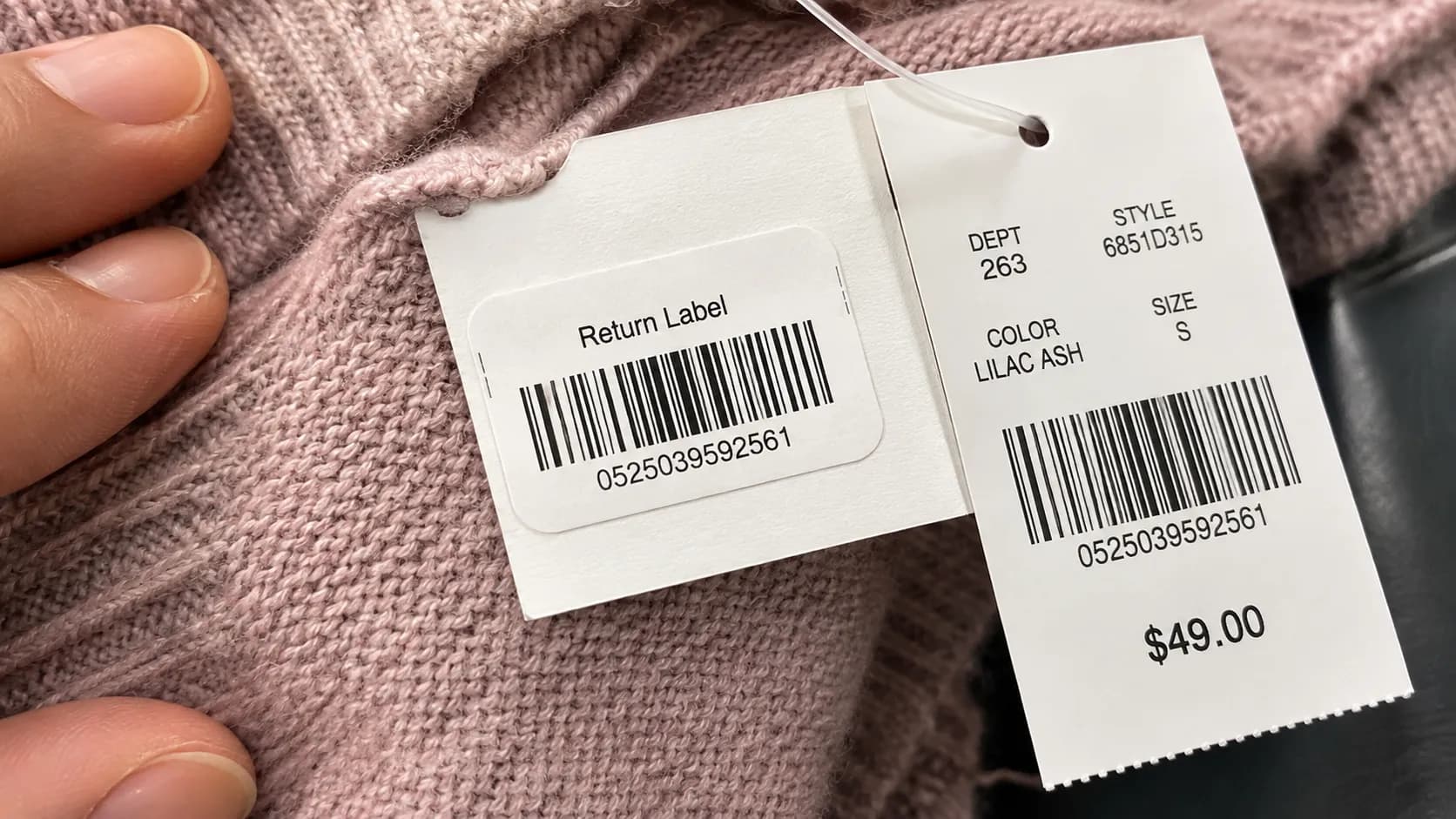 Macy’s white Return Label sticker on a clothing tag