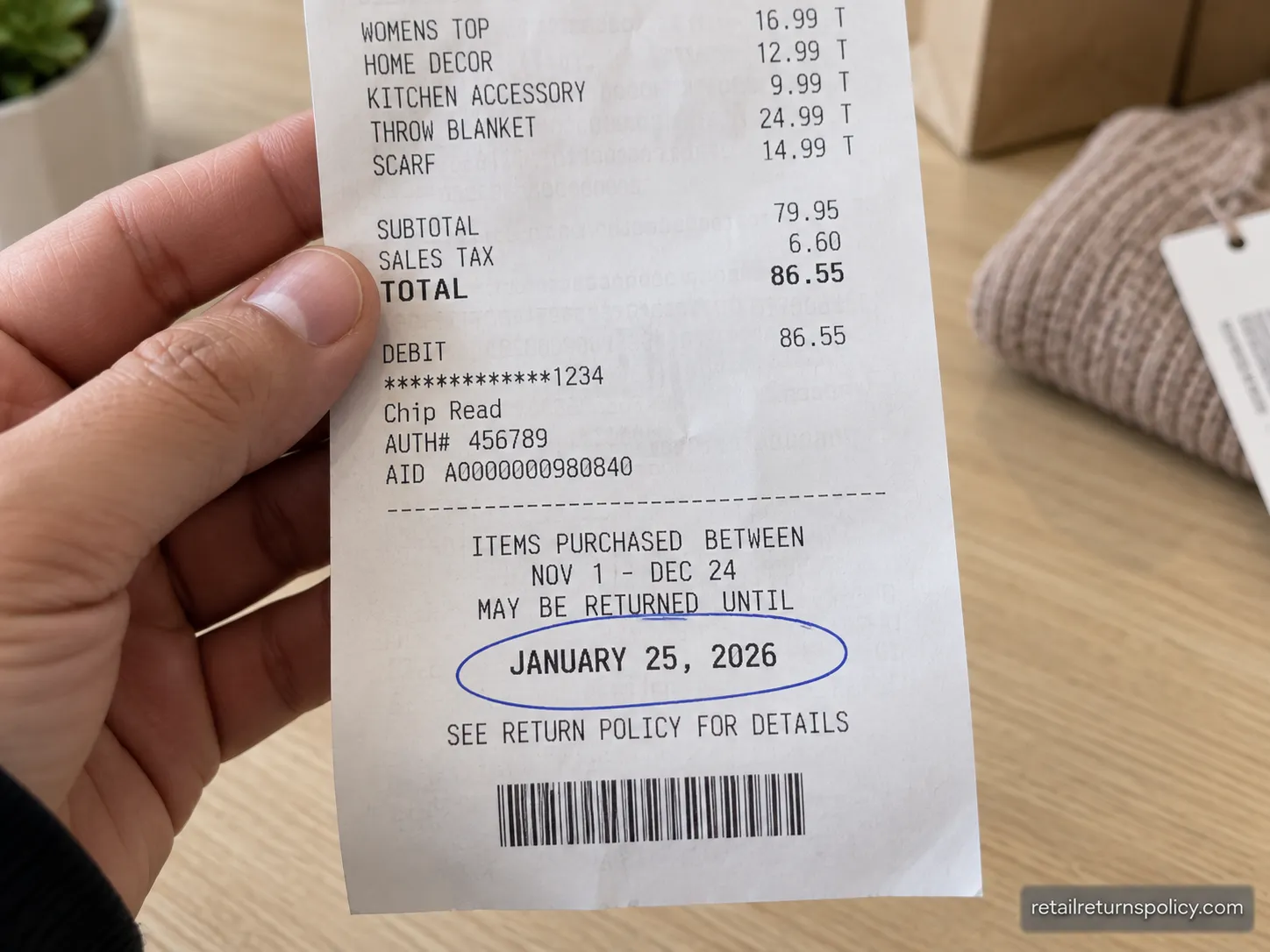 Hand holding a T.J. Maxx holiday receipt with the January 25 return-by date circled near the bottom.