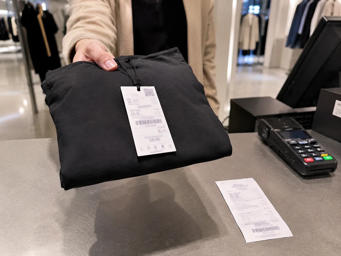 Unworn tagged Zara top presented for return on day 31 and declined at a United States store counter.